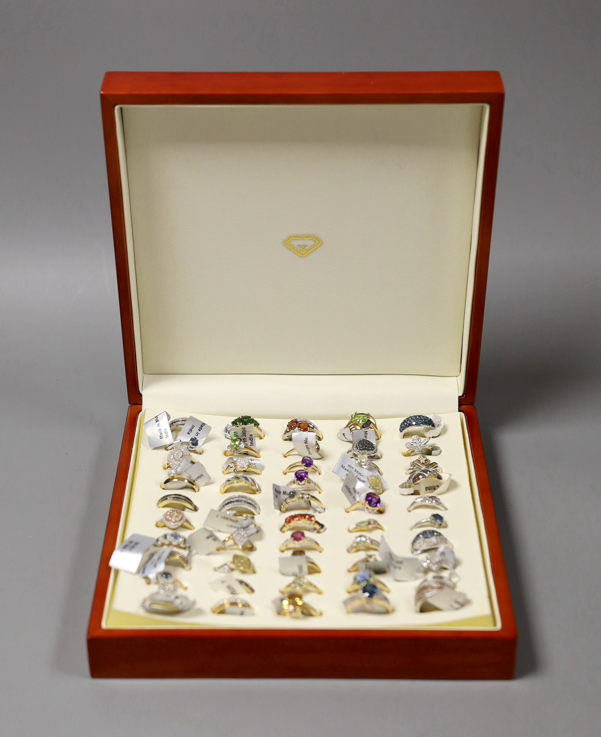 Fifty assorted modern gem set dress rings, to include thirty six 9ct gold rings including diamond set and thirteen 925 rings and a 925 pendant.